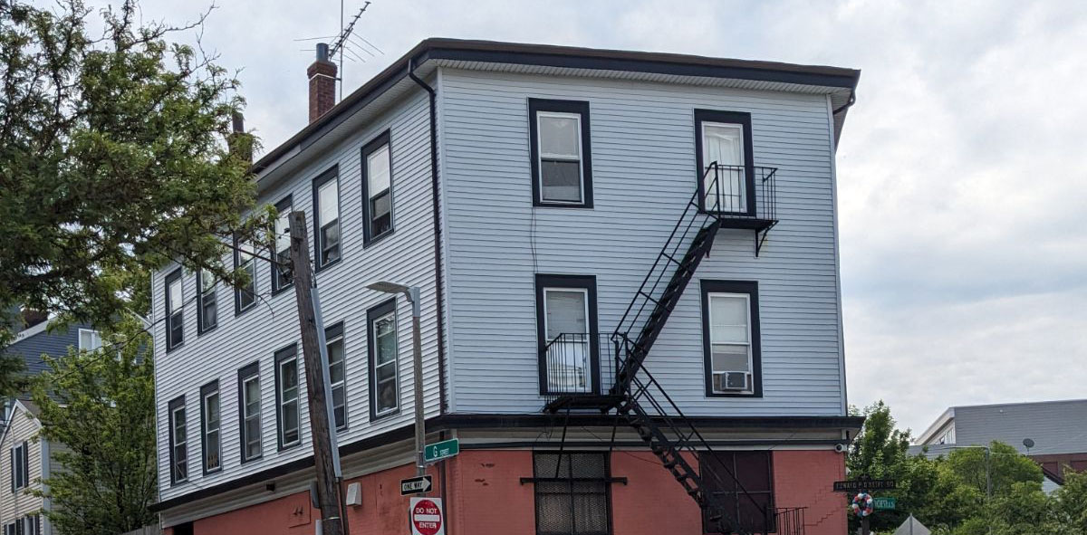 apartment building on the corner of a street